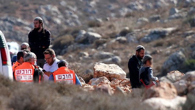 Injured being treated by medics near Qusra (Photo: EPA)