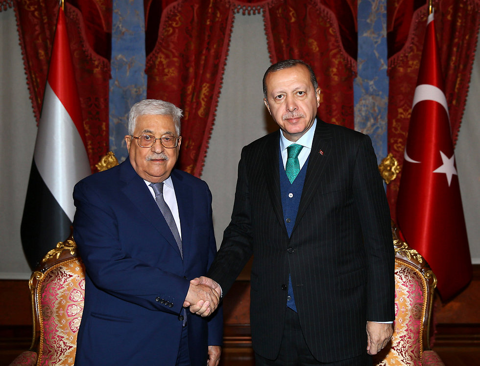Erdogan, right, welcomes Abbas to Istanbul (Photo: AP)