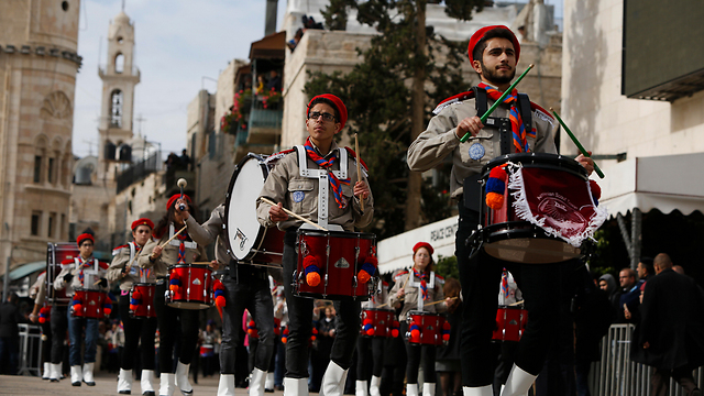 Band marches through the city (Photo: AP)