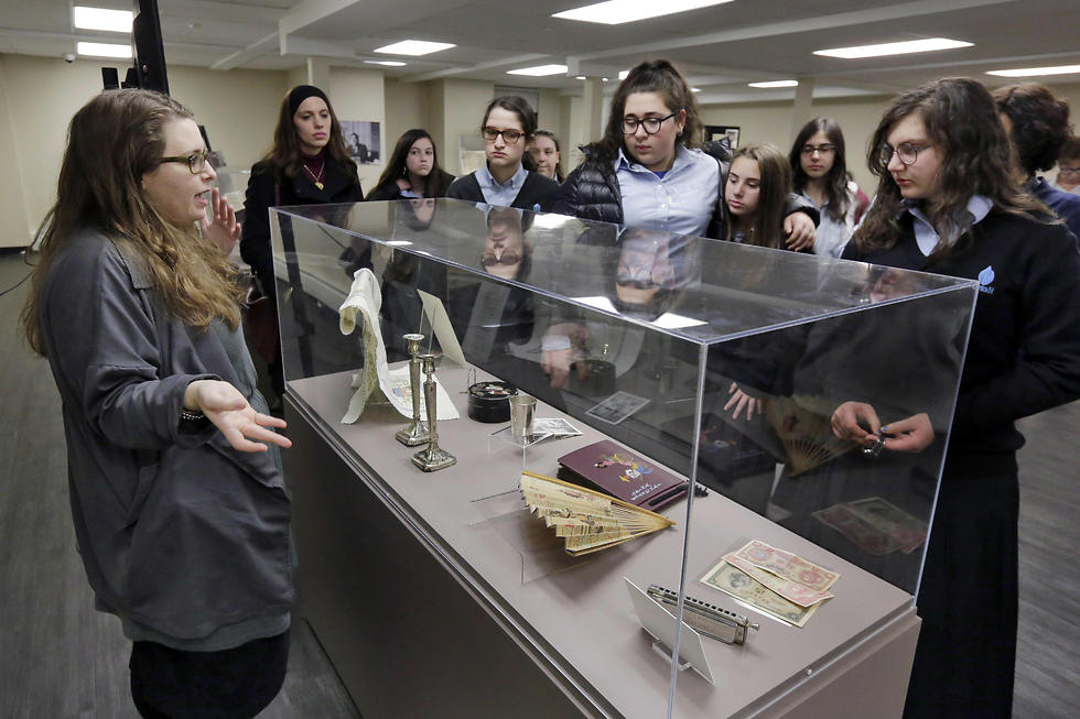 Miryam Gordon (L) leads a tour of the museum's "Precious Gift: Rescue and Shanghai" exhibit with a group of students from Brooklyn's Nefesh Academy (Photo: AP)