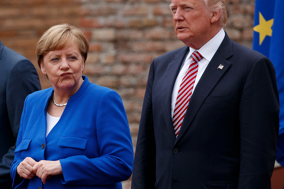 Дональд Трамп и канцлер Германии Ангела Меркельна саммите G7. Фото: АР
