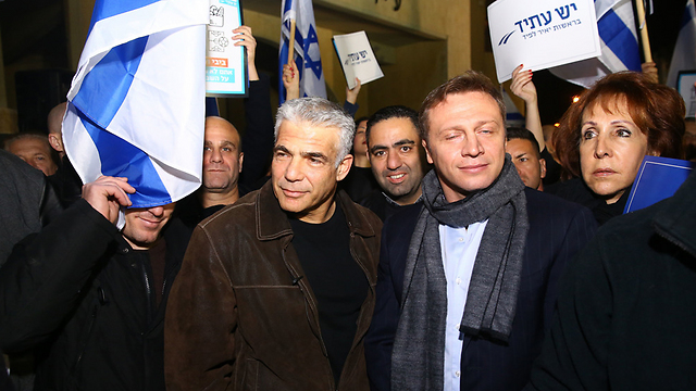 Lapid (L) at the protest