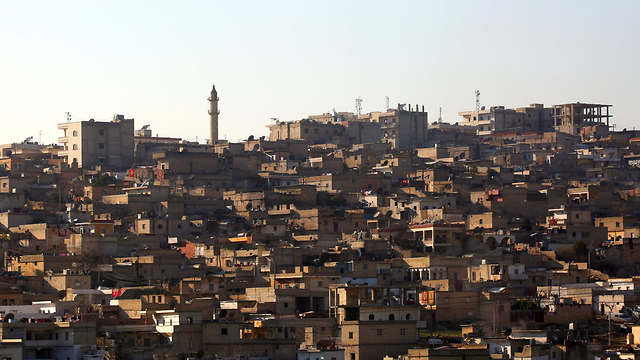 מובלעת כורדית שבה מתגוררים מאות אלפי תושבים. העיר עפרין (צילום: AFP) (צילום: AFP)