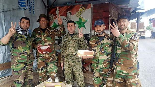 Syrian soldiers celebrating with treats