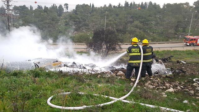 Firemen putting out plane that crashed near kibbutz Harduf (Photo: Fire & Rescue, Northern District)