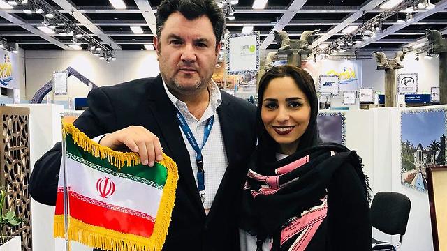 Lamberger (L) and the Iranian Tourism Ministry official at 2018 ITB Berlin