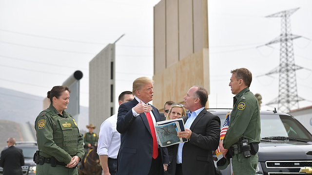 President Trump near the border wall prototype in San Diego  (Photo: AFP)
