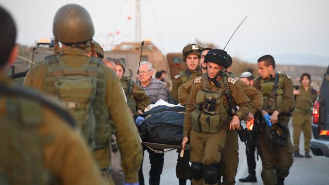 Wounded evacuated from scene of the attack (Photo: Yair Sagi)