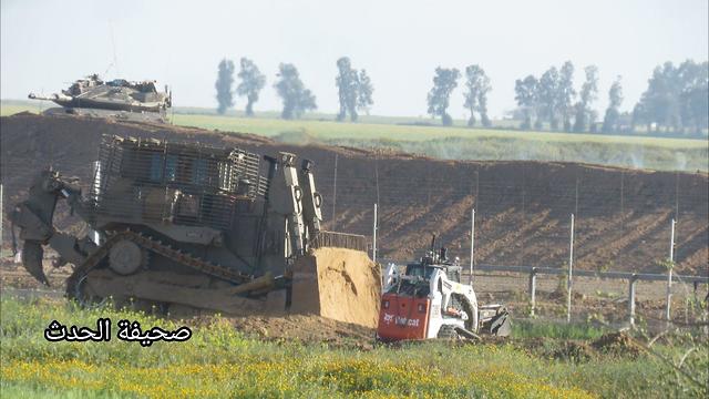 A military bulldozer near the Gaza border fence