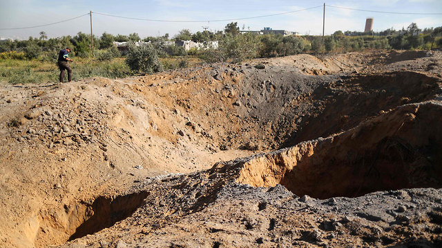 Holes created in the ground as a result of the IDF strike in Gaza on Saturday night  (Photo: AFP)