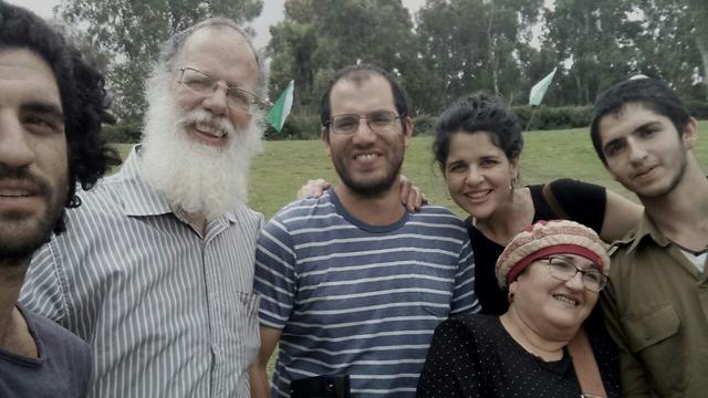 Adiel Kolman (center) and his family (Photo courtesy of the family)