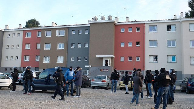 French security forces raid the terrorist's home (Photo: AFP)
