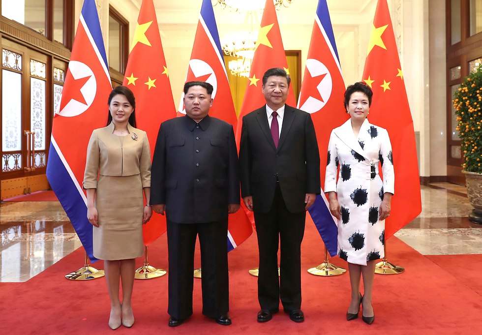Xi and his wife Peng Liyuan with Kim and his wife Ri Sol Ju  (Photo: AP)