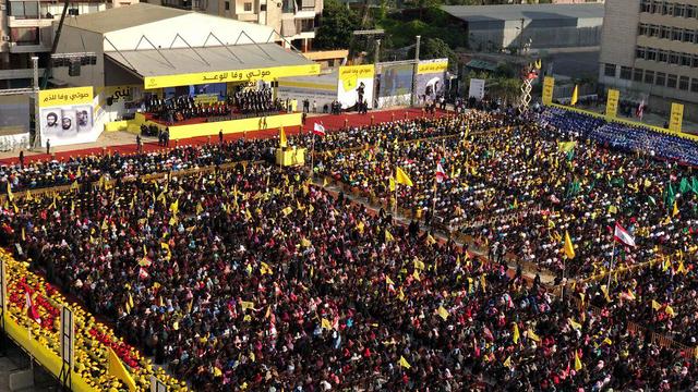 A crowd listens to a speech by Hezbollah leader Hassan Nasrallah in Beirut