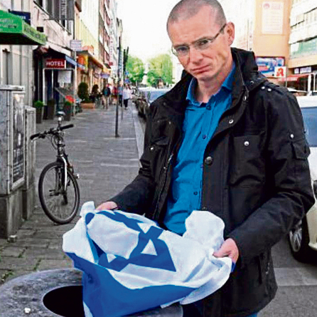 Israeli flag thrown in the trash