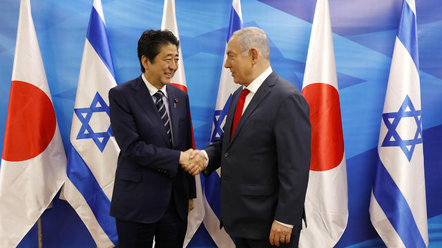 With Japanese PM Shinzo Abe (Photo: AFP)