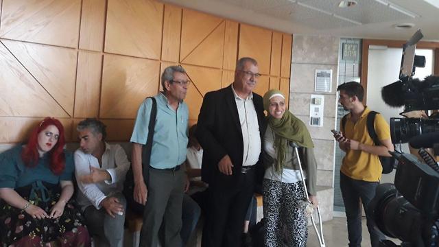 Tatour with her family in court