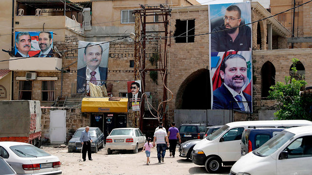 Election posters in Lebanon. Sixty-four seats for the Muslims, 64 seats for the Christians (Photo: AFP)