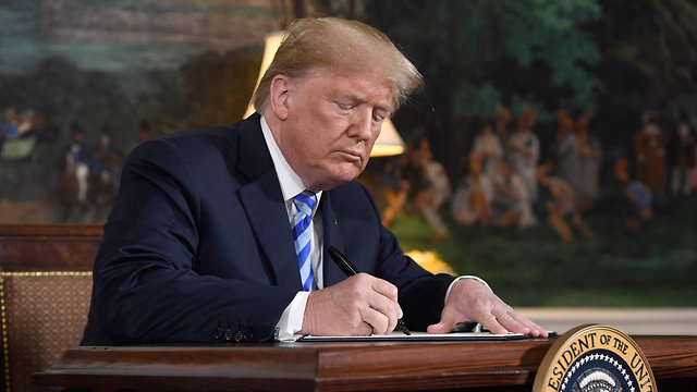 President Trump signed controversial Holocaust property legislation (Photo: AFP)