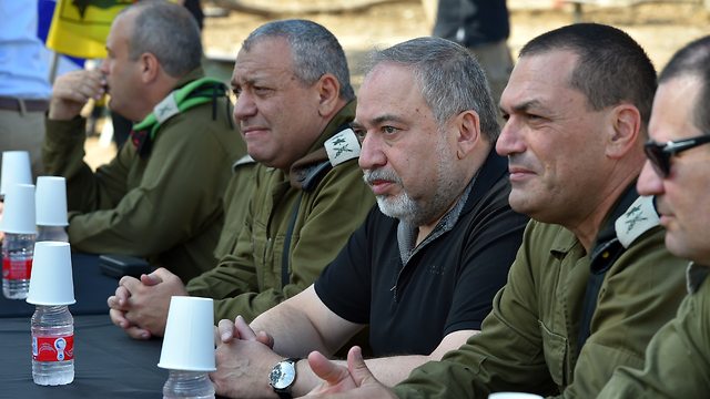 Defense Minister Lieberman (2nd right) said during a Gaza Division visit that Hamas used people and children as armaments (Photo: Ariel Hermoni, Defense Ministry)