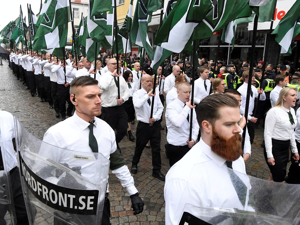 Members of the Neo-nazi Nordic Resistance Movement march through the town of Ludvika, Sweden (Photo: Reuters)