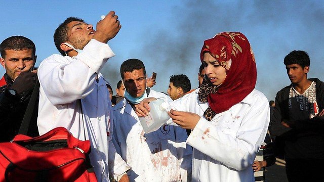 Razan Ashraf Najjar treating wounded Palestinians on Gaza border