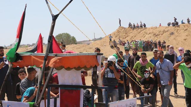 Palestinians on the Gaza border fence, Friday