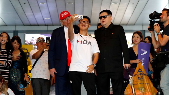 דונלד טראמפ וקים ג'ונג און (צילום: AP)