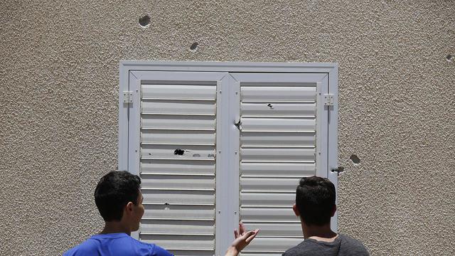 Damage caused to home from rocket shrapnel (Photo: EPA)