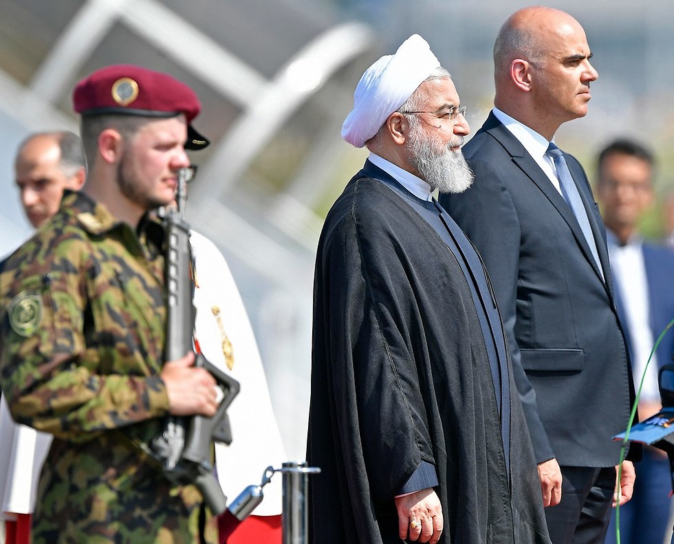 נשיא שוויץ אלן ברסט פגישה עם נשיא איראן חסן רוחאני (צילום: EPA)