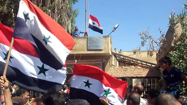 Флаги Сирии вернулись в Дераа. Фото: AFP