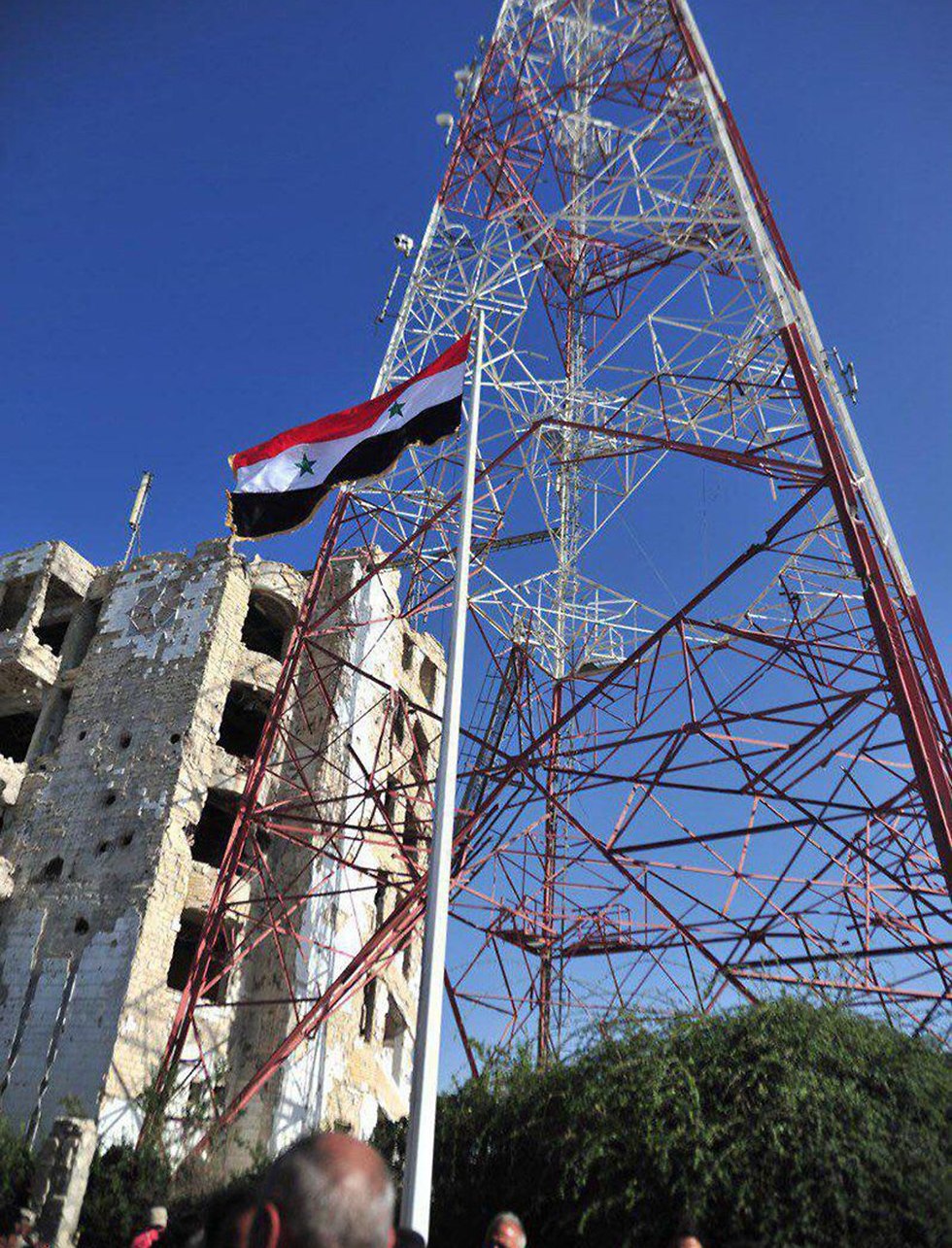 Флаги сирийского режима в Дераа. Фото: AFP