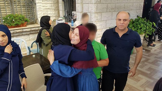 Family members celebrate Karim's release