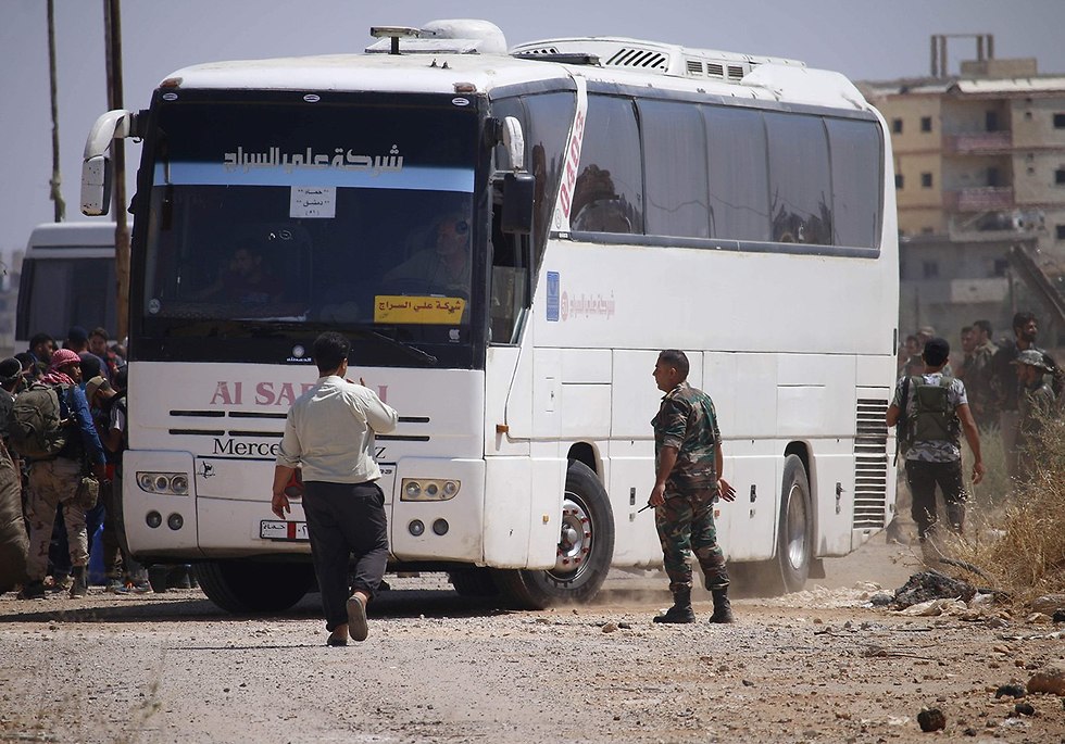 Повстанцы покидают Дераа. Фото: AFP