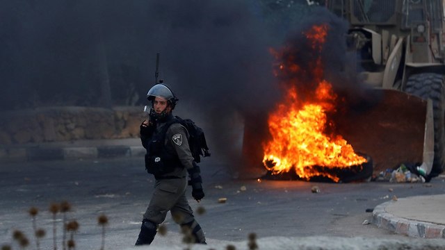 Clashes in Kobar (Photo: Reuters)