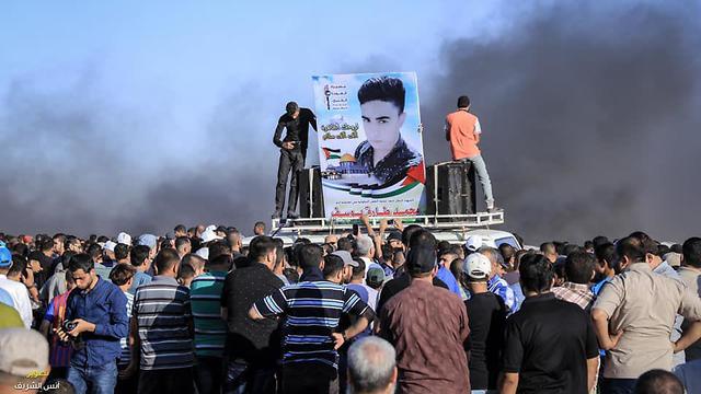 Gaza protesters with photo of terrorist who killed Israeli in deadly Adam stabbing attack