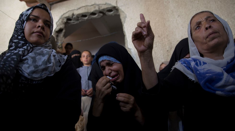Relatives of 11 year-old Majdi al-Satari (Photo: AP)