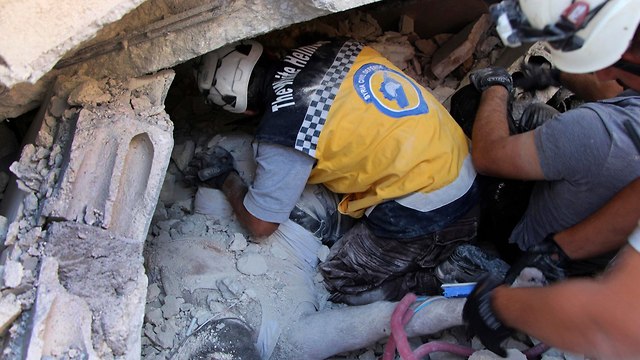 סוריה פיצוץ מצבור נשק שני בניינים קרסו עשרות הרוגים (צילום: AP)