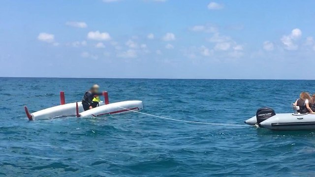 Dingy dragging the capsized catamaran (Photo: Oren Bar-Oz, Ronen Bussi and Oleg stolvetzor)