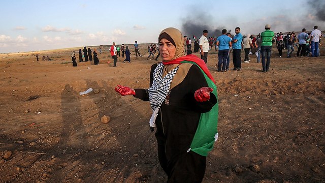 מהומות של פלסטינים בגבול רצועת עזה (צילום: AFP)