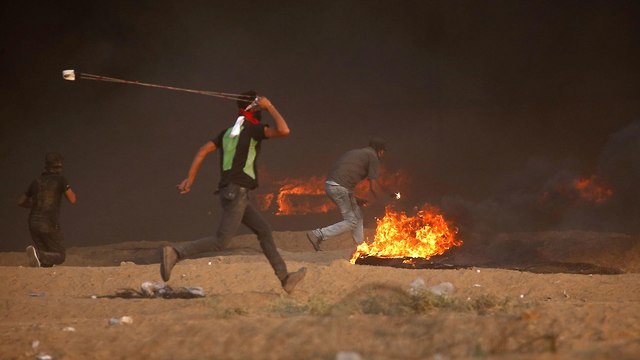 עימותים על הגדר בעזה (צילום: AFP)