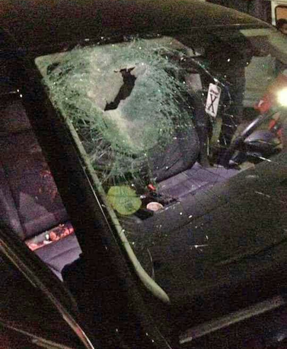 The shattered windshield of the couple's car