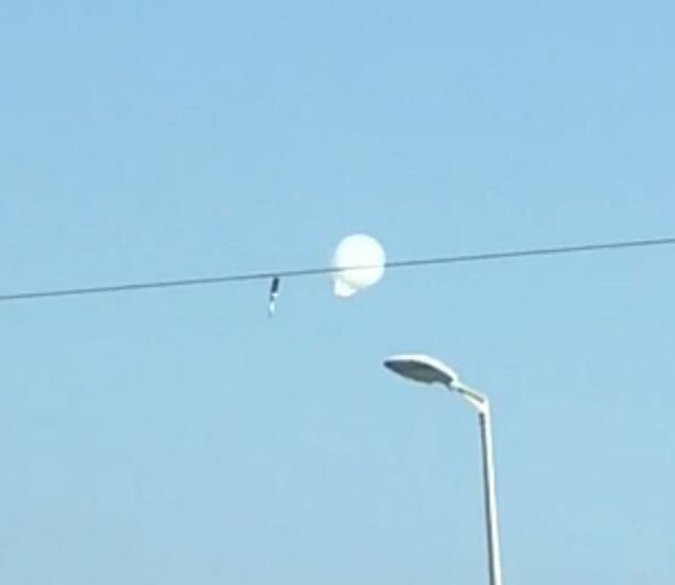 Incendiary balloon lands on electricity cable  (Photo: Matan Tzuri)