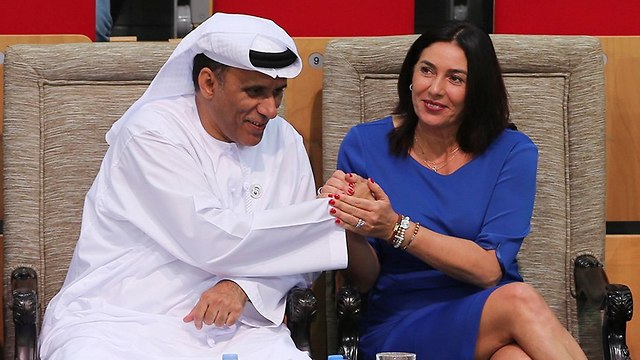 Regev with the president of the UAE's UAE Wrestling Judo & Kickboxing Federation (Photo: AP)