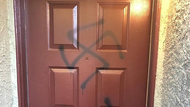 swastika on the door of a Jewish family in Los Vegas