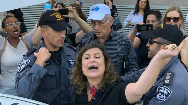 Inbal Hermoni, head of the Social Workers Union, getting arrested at the Tel Aviv protests earlier this year.