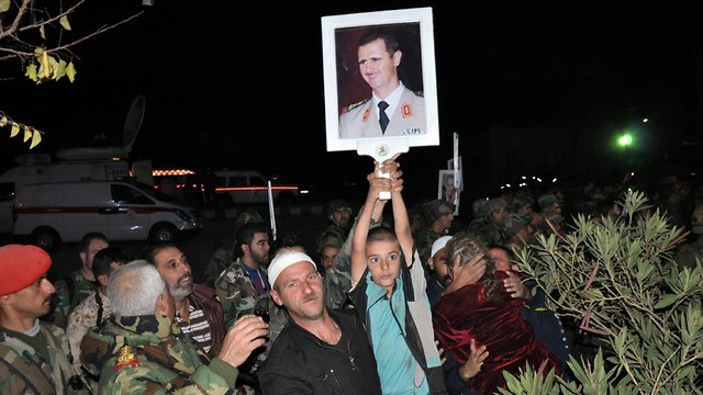 דרוזים ששוחררו משבי דאעש מחוז סווידה סוריה (צילום: AFP, SANA )