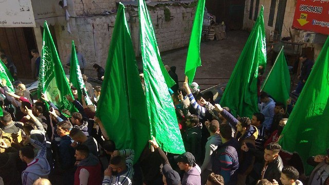 Hamas members mark the group's 31st anniversary with a rally in Nablus