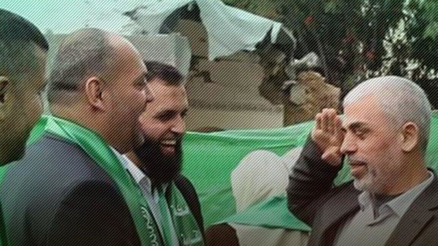 Hamas leader in Gaza Yahya Sinwar salutes Jassar Barghouti after the spate of attacks on Israelis