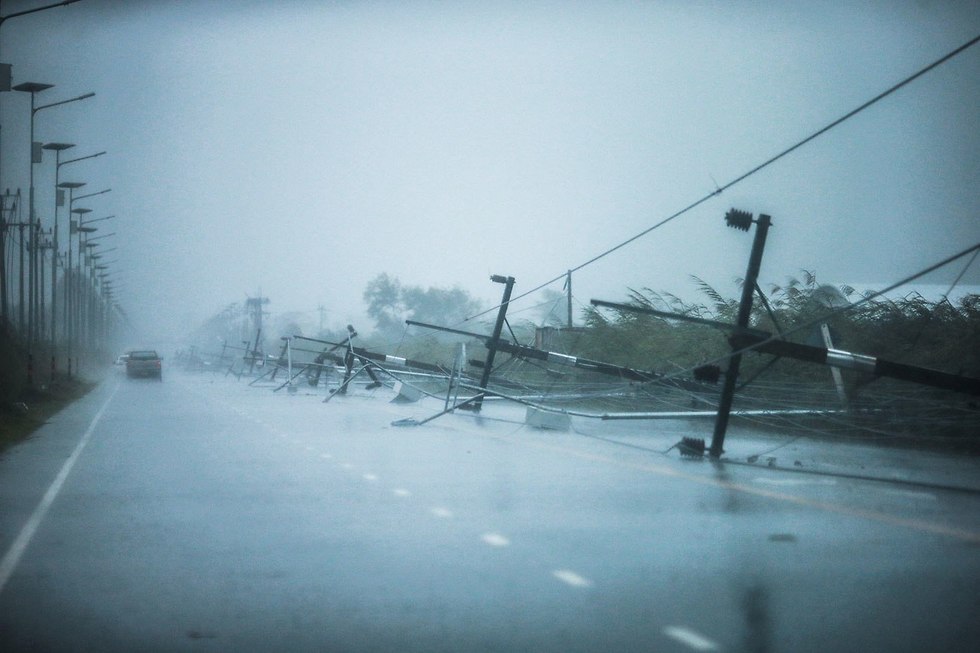 הסופה הטרופית פאבוק בנאקון סי טמרט, תאילנד (צילום: רויטרס)